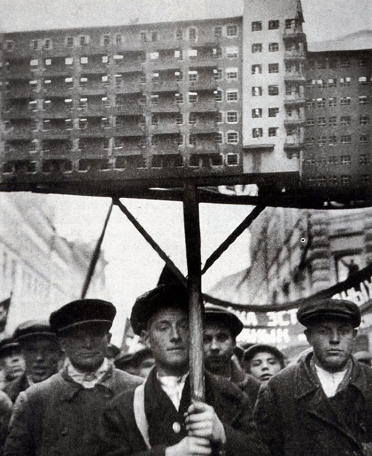 «Soviet workers with a model of planned housing», c. 1930